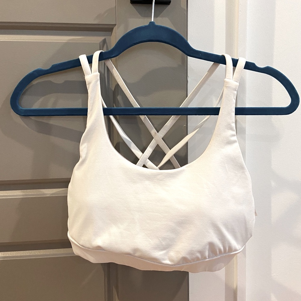 White Lululemon sports bra with strap detail in back